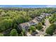 Aerial view of well-maintained homes nestled amongst lush trees in a tranquil neighborhood setting offering a serene living experience at 1928 Grace Point Rd, Morrisville, NC 27560