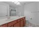 Bathroom with double sink vanity and tile floors at 1928 Grace Point Rd, Morrisville, NC 27560