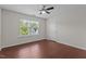 Comfortable bedroom with a ceiling fan and view through the window at 1928 Grace Point Rd, Morrisville, NC 27560