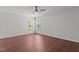 Bedroom with hardwood floors, a ceiling fan, and lots of natural light at 1928 Grace Point Rd, Morrisville, NC 27560
