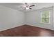 Bedroom with hardwood floors, ceiling fan and bright window at 1928 Grace Point Rd, Morrisville, NC 27560
