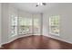 Bright bedroom featuring hardwood floors, large bay windows and neutral walls and trim at 1928 Grace Point Rd, Morrisville, NC 27560