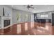 Spacious living area with hardwood floors, fireplace, and an open view to the kitchen at 1928 Grace Point Rd, Morrisville, NC 27560