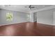 Spacious main bedroom boasts hardwood floors, a ceiling fan, recessed lighting and lots of natural light at 1928 Grace Point Rd, Morrisville, NC 27560