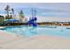 Community swimming pool with a waterslide, splash features, and plenty of room for swimming and recreation at 1928 Grace Point Rd, Morrisville, NC 27560