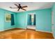 Bedroom featuring a blue paint scheme, hardwood flooring, and window seat at 2021 Sunnybrook Dr, Burlington, NC 27215