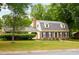 Charming two-story brick home with dormer windows and a manicured front lawn at 2021 Sunnybrook Dr, Burlington, NC 27215
