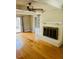 Cozy living room with brick fireplace and built-in shelves at 2021 Sunnybrook Dr, Burlington, NC 27215
