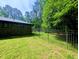 Fenced backyard with plenty of green grass at 2100 Possum Trot Rd, Wake Forest, NC 27587