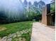 Expansive backyard featuring a mix of stone and concrete patios at 2100 Possum Trot Rd, Wake Forest, NC 27587