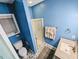 Bathroom with blue walls, shower, and patterned tile flooring at 2100 Possum Trot Rd, Wake Forest, NC 27587