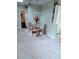 Cozy dining area with a glass-top table, four chairs, and bright natural light at 2100 Possum Trot Rd, Wake Forest, NC 27587