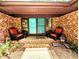 Covered front porch with comfortable seating and charming double doors at 2100 Possum Trot Rd, Wake Forest, NC 27587