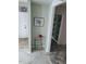 Hallway with light green walls, decorative art, and decorative wall paper at 2100 Possum Trot Rd, Wake Forest, NC 27587