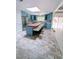 Bright kitchen with blue cabinets, a central island, stainless steel appliances, and a skylight at 2100 Possum Trot Rd, Wake Forest, NC 27587