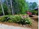 Lush landscaping with a variety of plants and colorful flowers around the property at 2100 Possum Trot Rd, Wake Forest, NC 27587