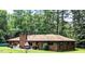 Back of a brick home with a patio area perfect for outdoor entertaining and relaxation at 2100 Possum Trot Rd, Wake Forest, NC 27587
