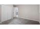 Spacious carpeted bedroom featuring a closet and view into the attached bathroom at 2222 Oak Ridge Blvd, Durham, NC 27707
