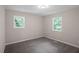 Bright bedroom features carpeting and natural light at 2222 Oak Ridge Blvd, Durham, NC 27707