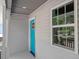 Home with blue door, gray siding, white trim, and a window at 2222 Oak Ridge Blvd, Durham, NC 27707