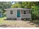 Charming single-story home with a welcoming front porch and a vibrant teal door at 2222 Oak Ridge Blvd, Durham, NC 27707
