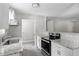 Updated kitchen boasts granite counters, stainless appliances, and hardwood floors at 2222 Oak Ridge Blvd, Durham, NC 27707