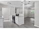 Updated kitchen looks into living room with stainless appliances and granite counters at 2222 Oak Ridge Blvd, Durham, NC 27707