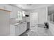 Updated kitchen features white cabinets, stainless appliances and granite counters at 2222 Oak Ridge Blvd, Durham, NC 27707