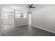 Spacious living room views kitchen and features hardwood floors and a ceiling fan at 2222 Oak Ridge Blvd, Durham, NC 27707