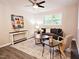 Inviting living room with a ceiling fan, ample natural light, and modern decor at 2222 Oak Ridge Blvd, Durham, NC 27707