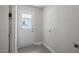 Mud room with gray walls, a back door with a window, and hookups for a washer and dryer at 2222 Oak Ridge Blvd, Durham, NC 27707