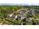 This aerial shot features houses with green lawns, fenced yards, and lovely landscaping on a tranquil street at 2503 Macdougall Dr, Burlington, NC 27217