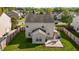 Aerial view of the backyard featuring a concrete patio with an outdoor dining set at 2503 Macdougall Dr, Burlington, NC 27217