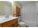 Well-lit bathroom with modern fixtures and wooden cabinets, offering a refreshing and functional space at 2503 Macdougall Dr, Burlington, NC 27217
