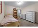 Serene bedroom featuring a four-poster bed and ample closet space for a tranquil retreat at 2503 Macdougall Dr, Burlington, NC 27217