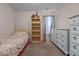 Serene bedroom featuring a four-poster bed and ample closet space for a tranquil retreat at 2503 Macdougall Dr, Burlington, NC 27217