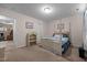 Bright bedroom featuring a four-poster bed and built in storage, offering relaxation and functionality at 2503 Macdougall Dr, Burlington, NC 27217