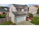 Charming two-story home with a two-car garage and landscaped front yard at 2503 Macdougall Dr, Burlington, NC 27217