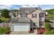 Attractive two-story home with red shutters, attached two-car garage, and a tree-lined backdrop at 2503 Macdougall Dr, Burlington, NC 27217