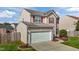 Cozy two-story home with a well-manicured lawn, two-car garage, and walkway to the front entrance at 2503 Macdougall Dr, Burlington, NC 27217