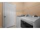 A laundry room featuring a white washer and dryer and wire shelving at 2503 Macdougall Dr, Burlington, NC 27217