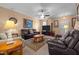 Relaxing living room featuring neutral decor, ceiling fan, and comfortable seating at 2503 Macdougall Dr, Burlington, NC 27217