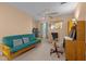 Cozy room with futon, ceiling fan, work space, and natural light creates a comfortable and productive atmosphere at 2503 Macdougall Dr, Burlington, NC 27217