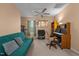 Cozy room with futon, ceiling fan, work space, and natural light creates a comfortable and productive atmosphere at 2503 Macdougall Dr, Burlington, NC 27217
