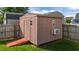 Wooden storage building that could be used as a shed, workshop, or playhouse at 2503 Macdougall Dr, Burlington, NC 27217