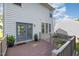 Cozy back deck with potted plants, a small table and chairs and sliding glass doors at 2612 Alder Ridge Ln, Raleigh, NC 27603