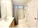 Bathroom features a shower and tub combo, vanity and medicine cabinet at 2612 Alder Ridge Ln, Raleigh, NC 27603