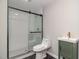 Bathroom with black hardware, modern glass shower, and hexagon tile floors at 2612 Alder Ridge Ln, Raleigh, NC 27603