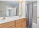 Bathroom features a double sink vanity and shower and tub combo at 2612 Alder Ridge Ln, Raleigh, NC 27603