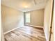 Bright bedroom featuring stylish, light-colored wood flooring and neutral wall paint at 2612 Alder Ridge Ln, Raleigh, NC 27603